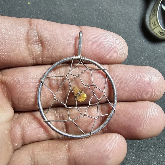 None Jewelry - Silver tone dreamcatcher pendant with yellow bead in the center